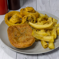 Livi Express golden-crust savoury pie served with chips and battered onion rings in Livingston.
